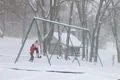 Girl Swinging in Snow Footage