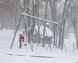 Girl Swinging in Snow SD Footage