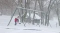 Girl Swinging in Snow HD Footage