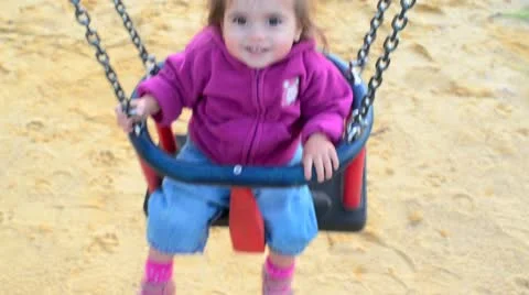 Girl swings on a swing 01 Stock Footage