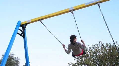 Girl swings on a swing 05 Stock Footage