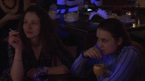 The girl at a table smoking Stock Footage 50010335