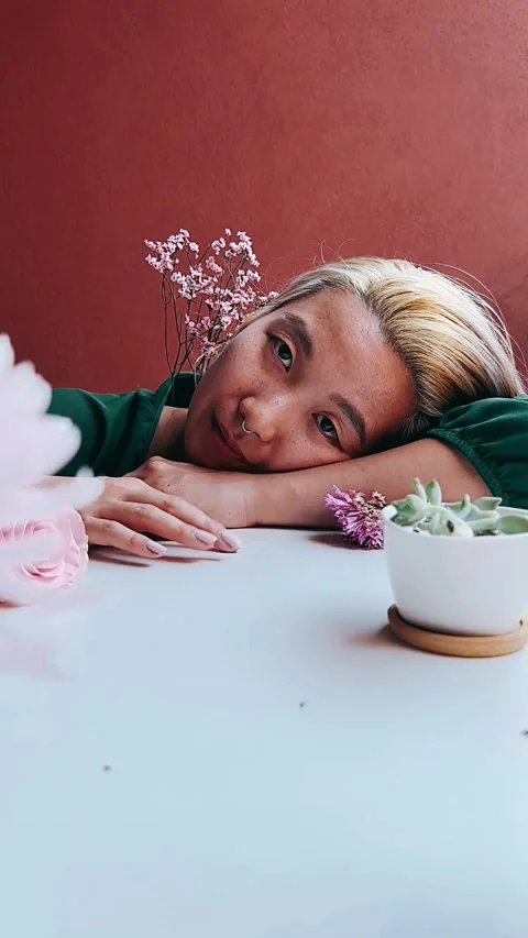 Girl at a table, table setting, portrait of a woman, flowers, fashion, 스톡 동영상 252308122