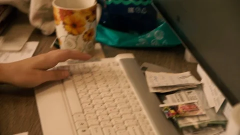 The girl at the table works on a computer mouse.It works fast. Stock Footage 125419147