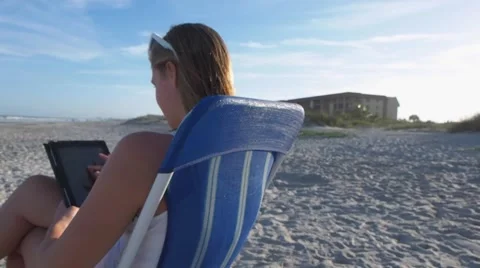 Girl with tablet at beach Stock Footage 48752580