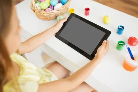 Girl with tablet computer, easter eggs and colors Foto stock