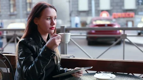 Girl with tablet drinking coffee Stock Footage 50982200