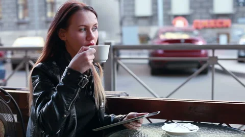 Girl with tablet drinking coffee Stock Footage 50982296