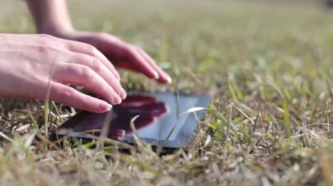 The girl with the tablet on the field Video stock 51859516