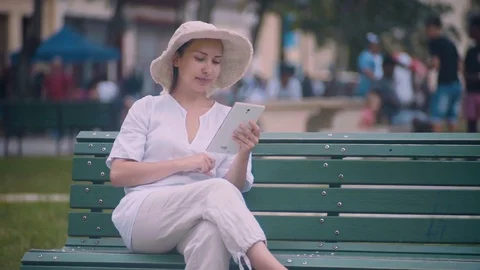 The girl with the tablet. In the park. Stock Footage 72486859