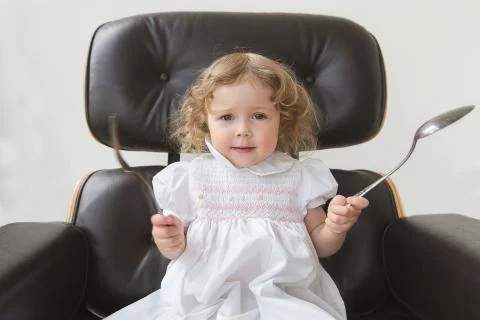 A girl with the tableware Stock Photos