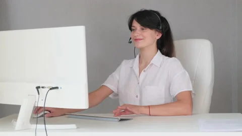 Girl takes a call from a client Stock Footage 136653938