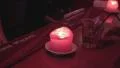 Girl takes cocktail in nightclub. Candle is lightning. HD Footage