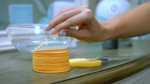 Girl takes a makeup sponge from the table Stock Footage 150704986