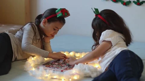 The girl takes out and eats a candy from the advent calendar. Stock Footage 221878889