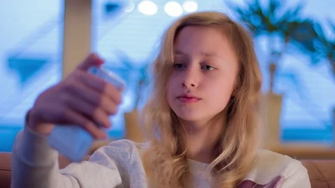 Girl takes self portrait using new app. Selfie snap photo, one girl only. Stock Footage 71781547