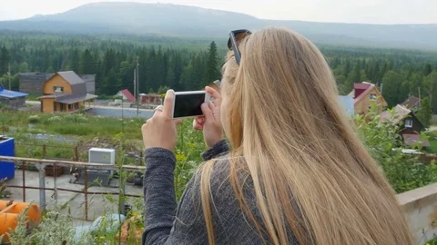 Girl takes something on the camera Video stock 80044210