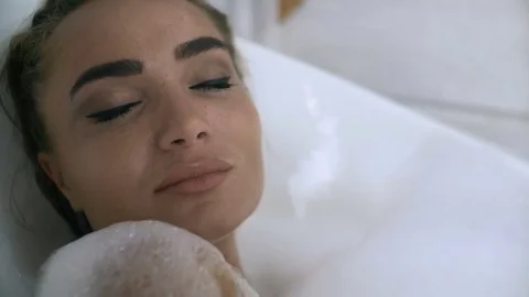 Girl taking a bath Stock Footage 80222716