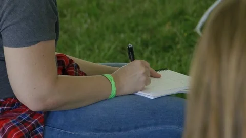 Girl taking notes Stock Footage 198073256