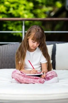 Girl taking notes Stock Photos