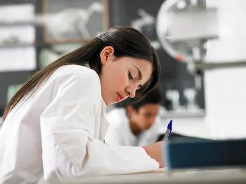 Girl Taking Notes In Science Class Stock Photos