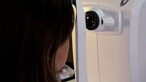 The girl is taking an ophthalmologic test Video stock 99704030