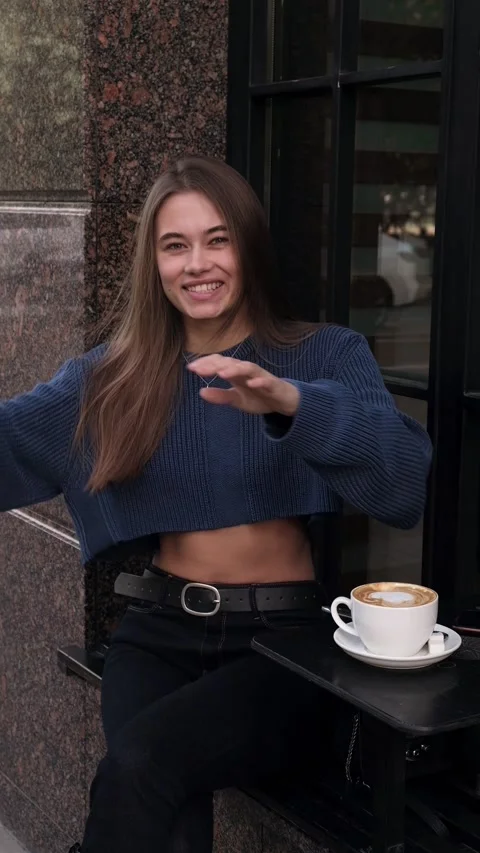 Girl talking and smiling. Looking at camera, vertical video Stock Footage 196699622
