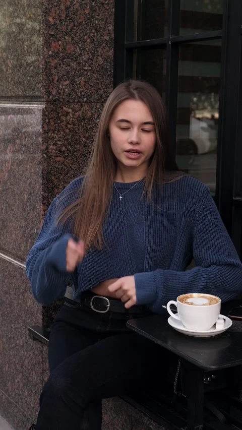Girl talking and smiling. Looking at camera, vertical video Stock Footage 196702885