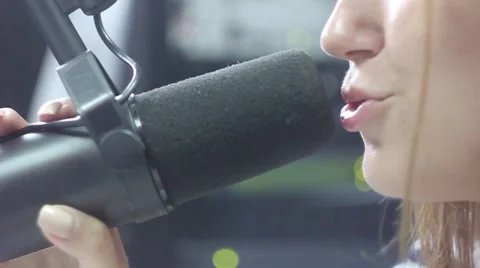Girl talking into the microphone Stock Footage 65482263