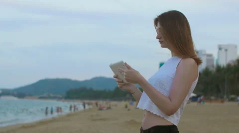 Girl talking with tablet at seaside Stock Footage 62869460
