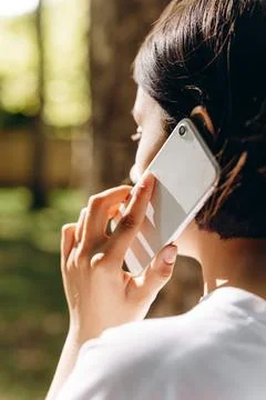 A girl is talking while looking at something. Stock Photos