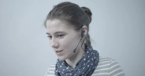 Girl from technical support. Face close-up. Without color correction Stock Footage 63182856