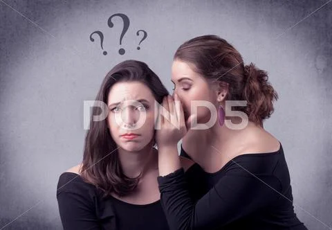 Girl telling secret things to her girlfriend Stock Photos