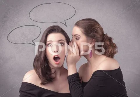 Girl telling secret things to her girlfriend Stock Photos