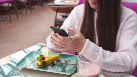Girl texting on mobile phone|Woman using messanger on smartphone in cafe Stock Footage 101532460