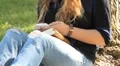 Girl Texting in Park HD Footage