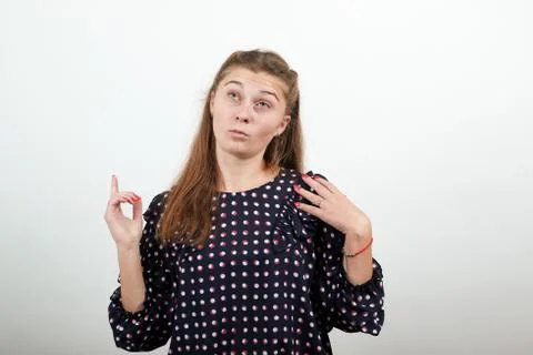 Girl thinks solving problem with smart facial expression Foto stock