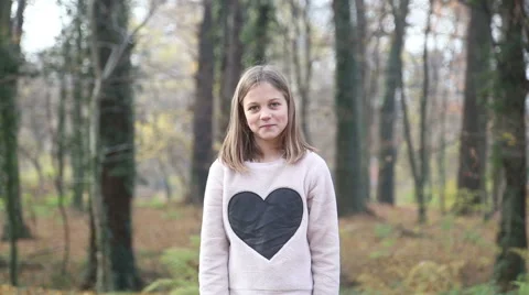 Girl throwing leaves and spinning around in the park Stock Footage 59553823