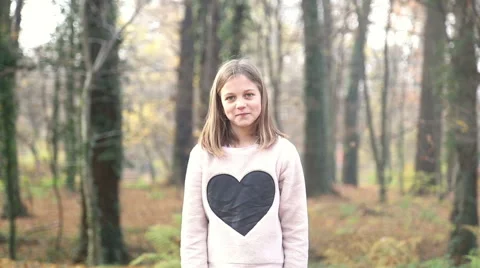 Girl throwing leaves and spinning around in the park Stock Footage 59553826