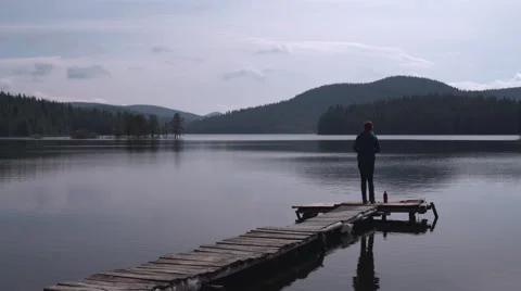 Girl Throwing Rocks in the Lake 4K Stock Footage 63921253