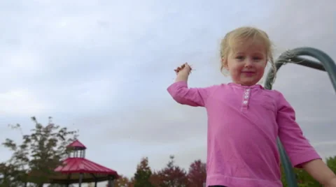 Girl throws bark chips at the camera Stock Footage 58409673