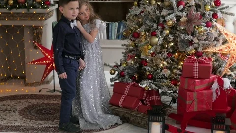 Girl throws a Christmas present on a background of Christmas decorations Stock-Footage 85134692
