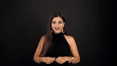 Girl throws up multi-colored confetti and smiles at the camera. The average plan Stock Footage 116747451