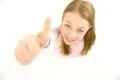 The girl thumbs up to the camera. View from above Photo