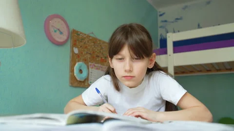 Girl tired of doing lessons Stock Footage 88398580
