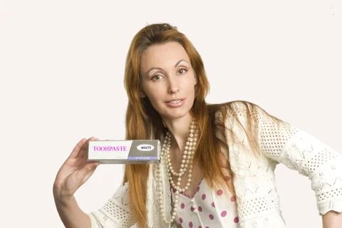Girl with toothpaste Stock Photos