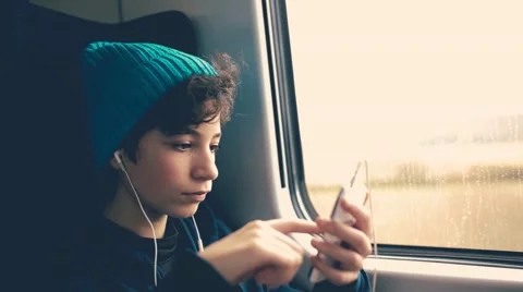 Girl on Train using smartphone Stock Footage 48937383