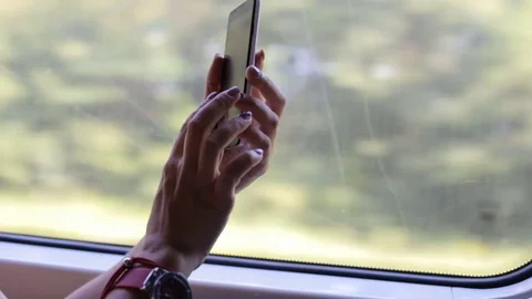 Girl on the train working on the smartphone Vídeo Stock 79996457