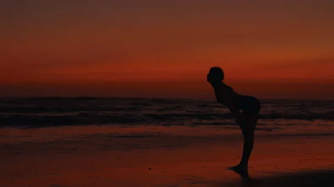 Girl Trainer Performs Exercises in the Fresh Air. Sporty Woman Stretches Her Stock Footage 258557831