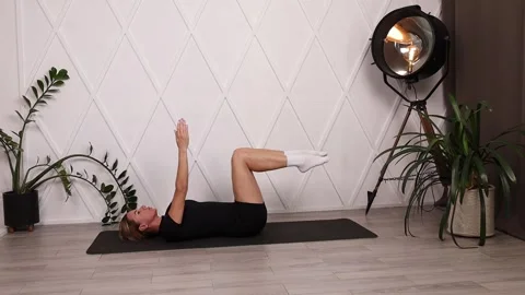 Girl training. Exercise dead bug. Stock Footage 280159957